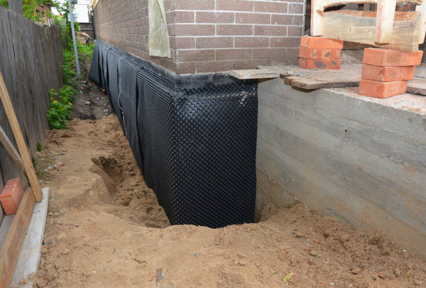 Happy homeowners after waterproofing job in Daleville